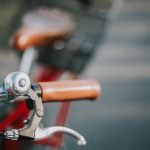 shallow focus photography of bicycle brake lever