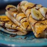 brown and white pastry on blue round plate